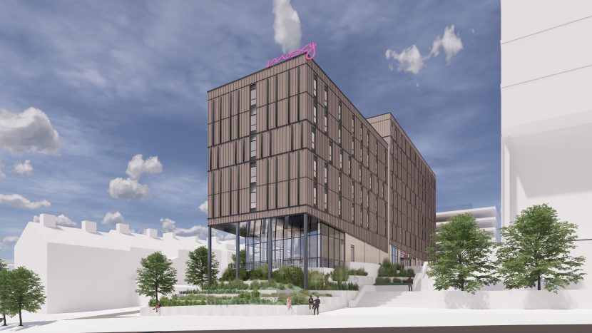 CGI image of Moxy Hotel. Brown large oblong block with slim glass windows throughout. Entrance at the bottom is full glass panels.