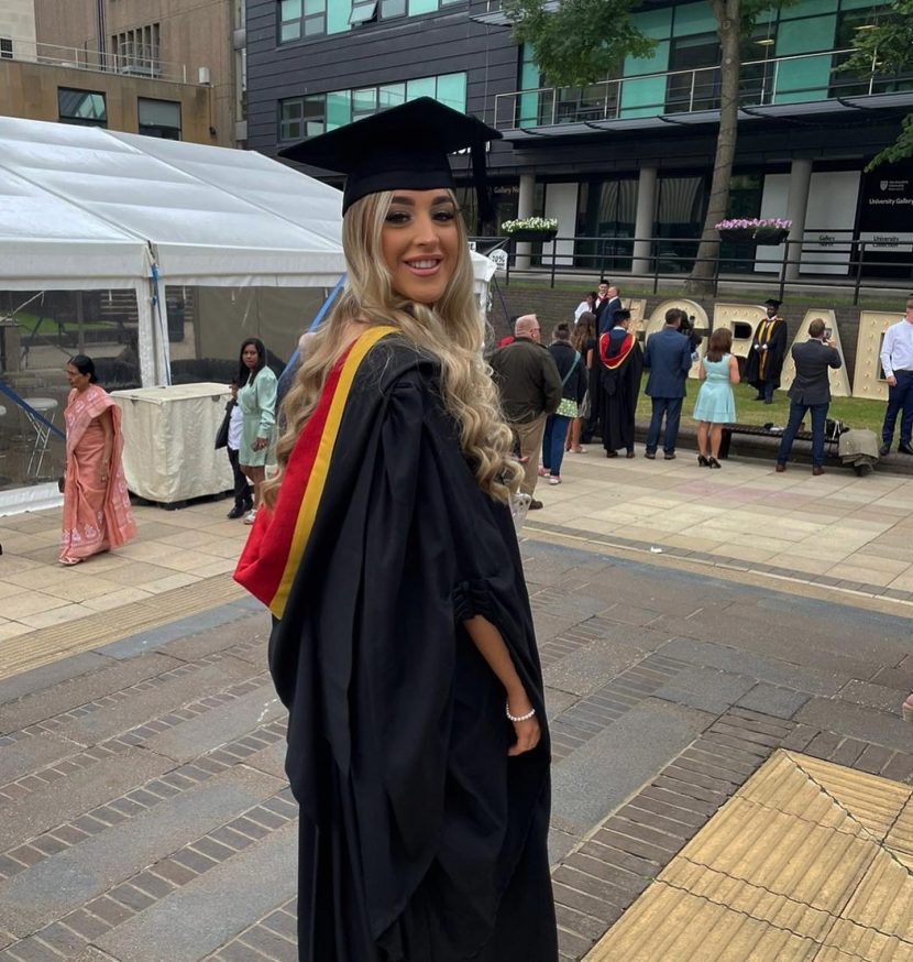 Image of Georgia in graduate gown and cap