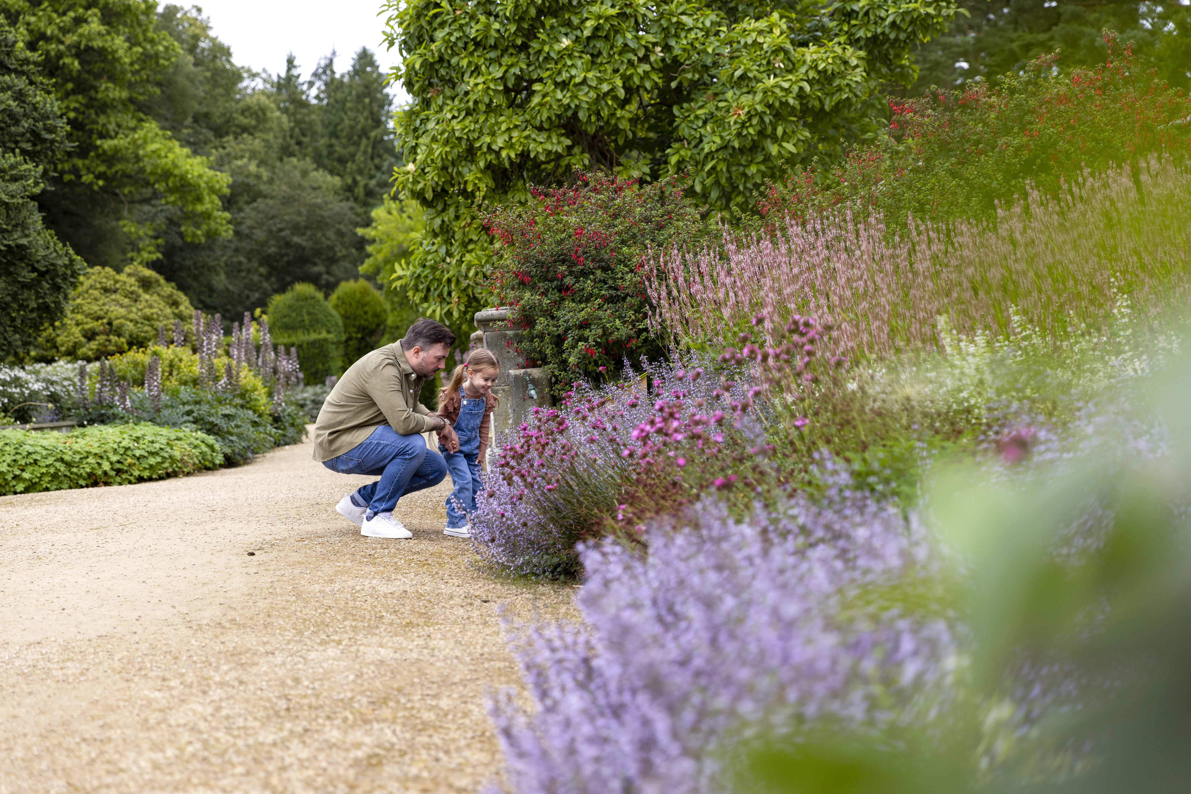 Adult and child looking at foliage at Belsay Hall gardens