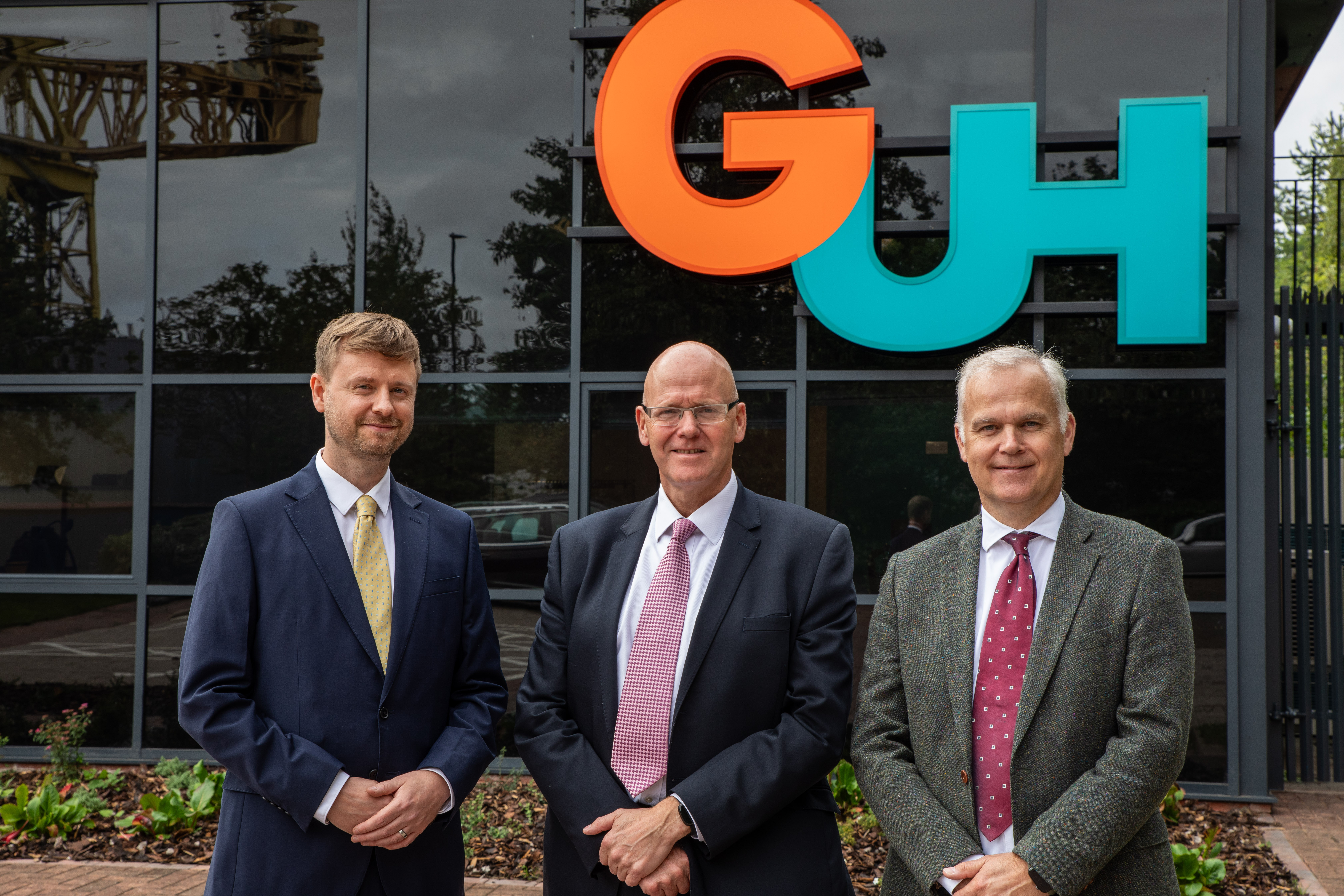 Three leaders outside the Global Underwater Hub office in Newcastle