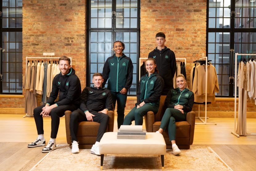 Newcastle United players at Fenwick Newcastle smiling at the camera. (L-R) Mark Gillespie, Elliot Anderson, Naomi Bedeau, Elysia Boddy, Lewis Miley & Emma Kelly