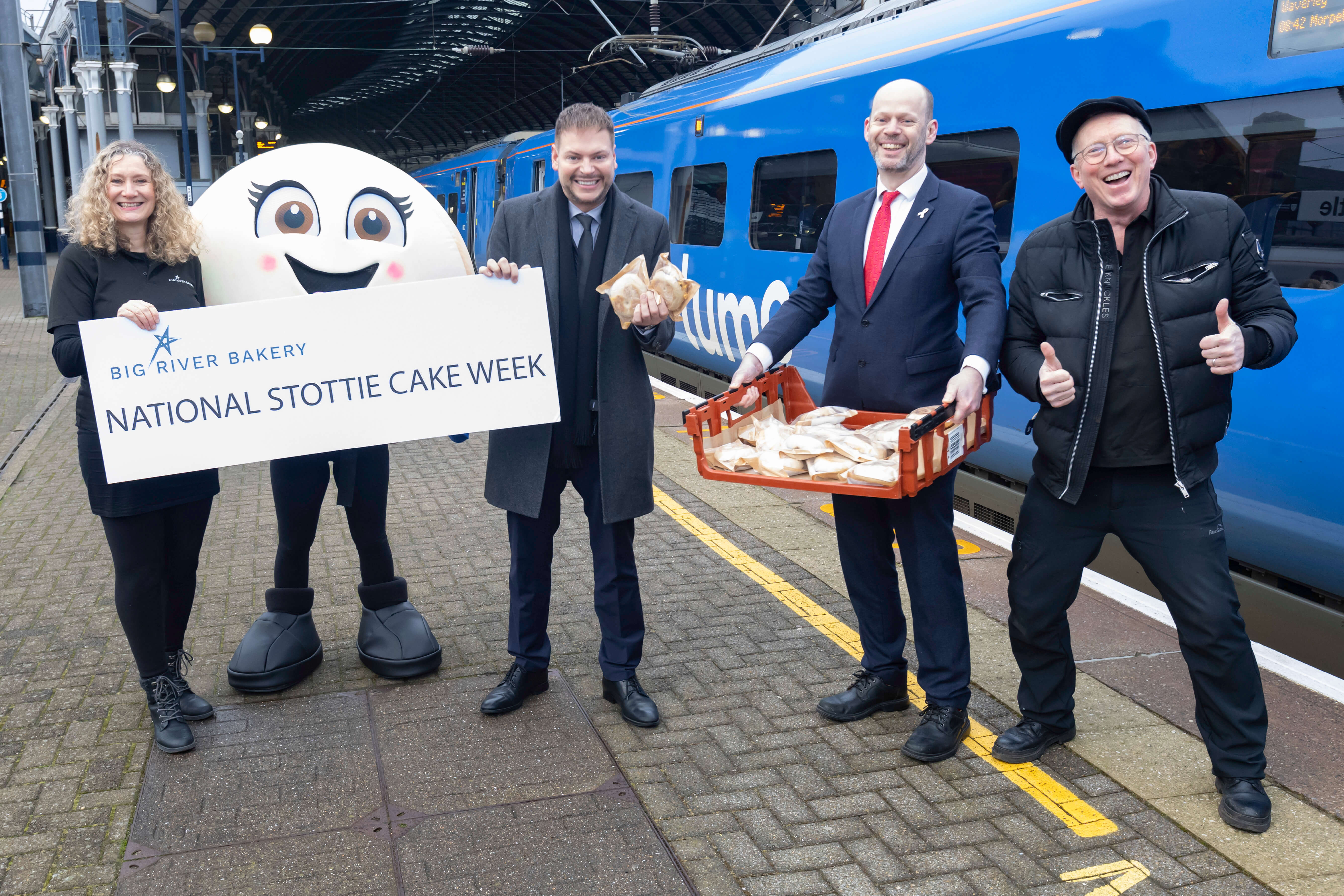 Gail Lawler, Scottie The Stottie (a large stottie mascot), Martijn Gilbert, Managing Director of Lumo, North of Tyne Mayor Jamie Driscoll and Andy Haddon from Big River Bakery.