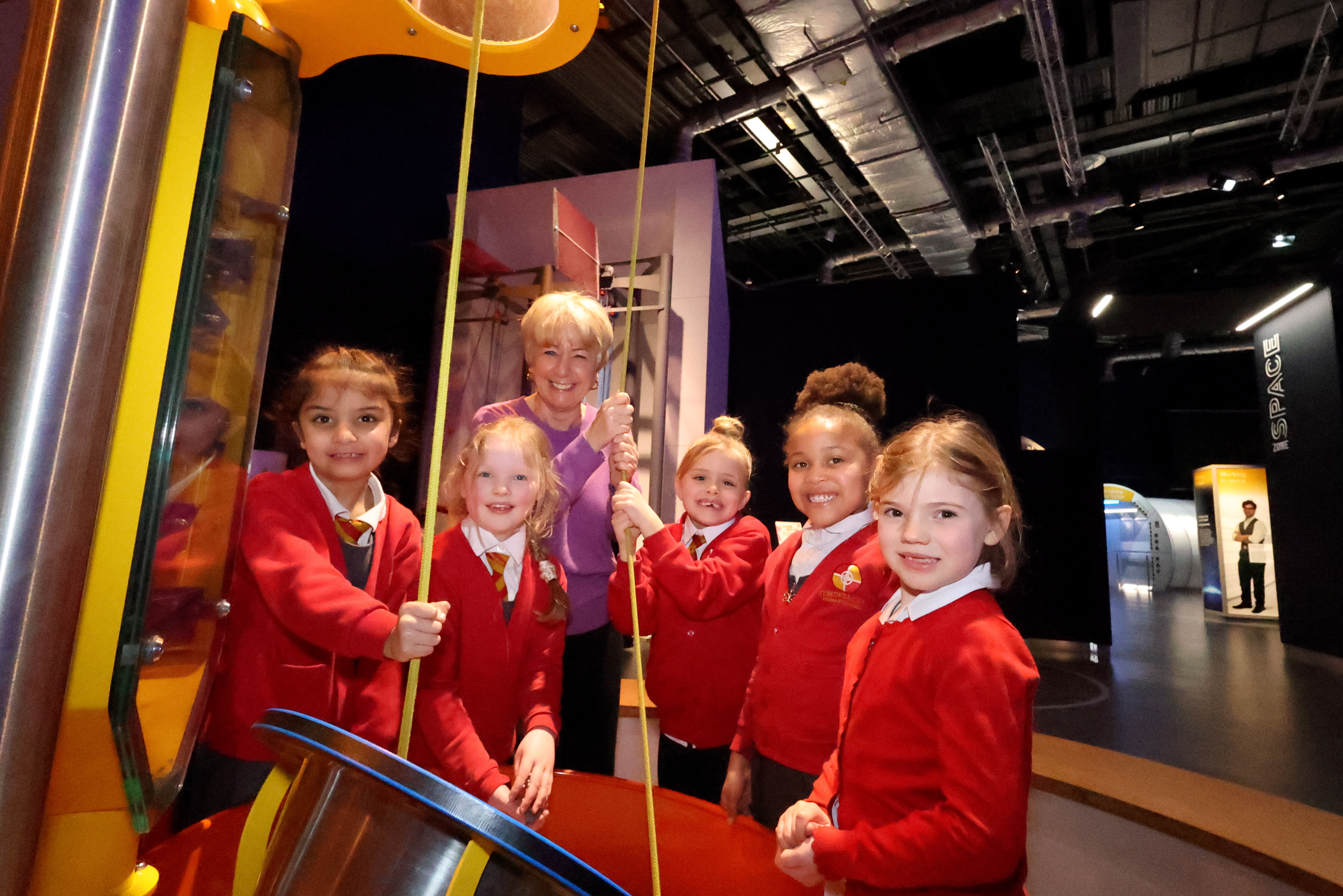 Group of school pupils with Life Chief Executive celebrating International Womens Day at the Centre for Life