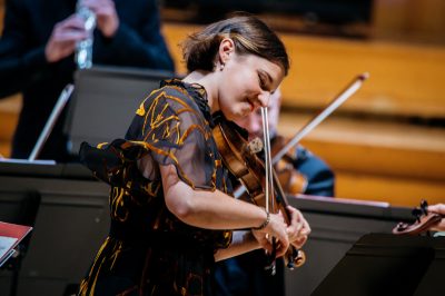 Woman playing violin.