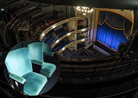 View of Tyne Theatre & Opera House stage from the Gallery above with a small circle overlayed with image of two of their blue/green chairs.