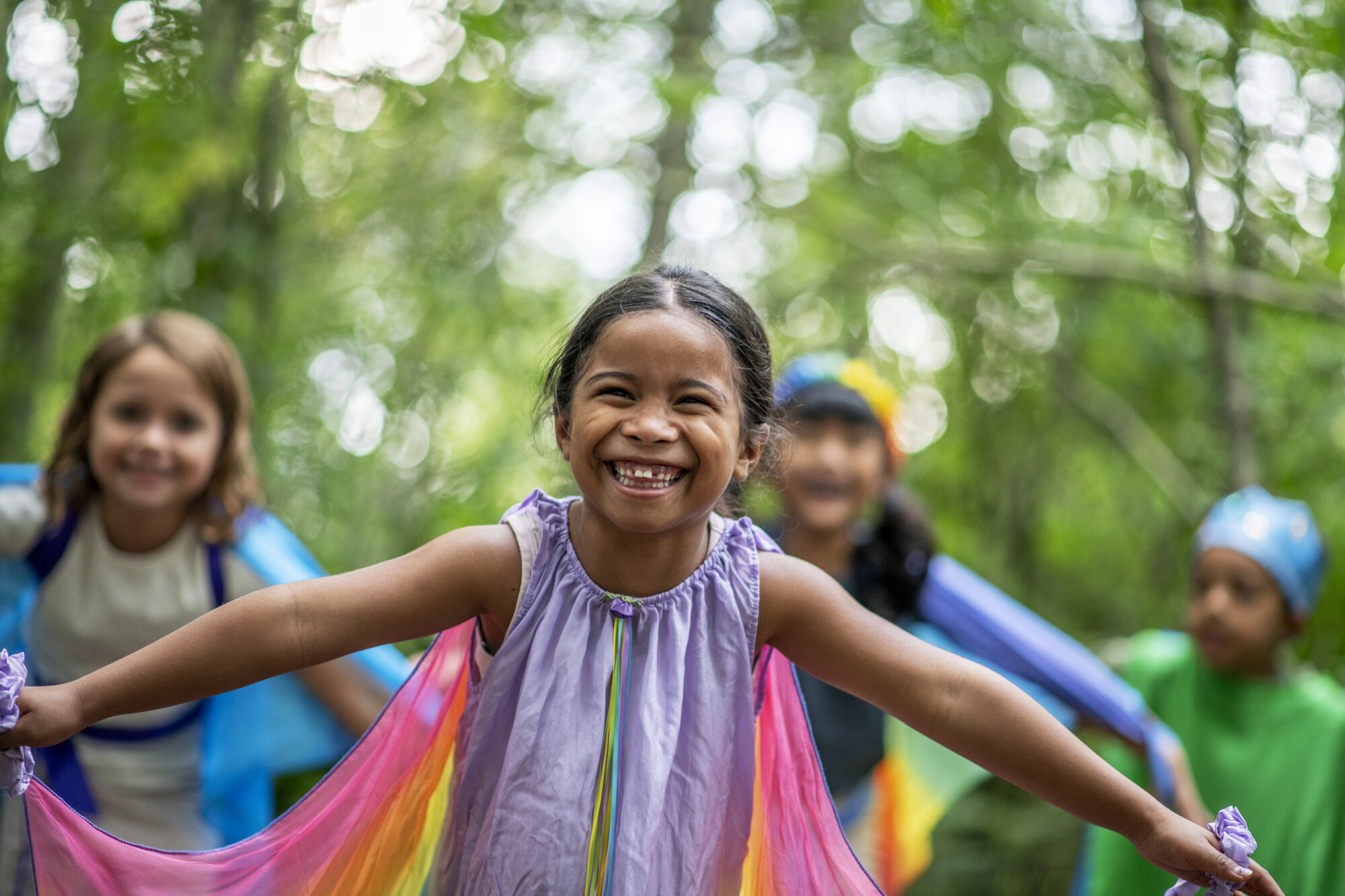 Children playing in the forest at Dragonfly Festival