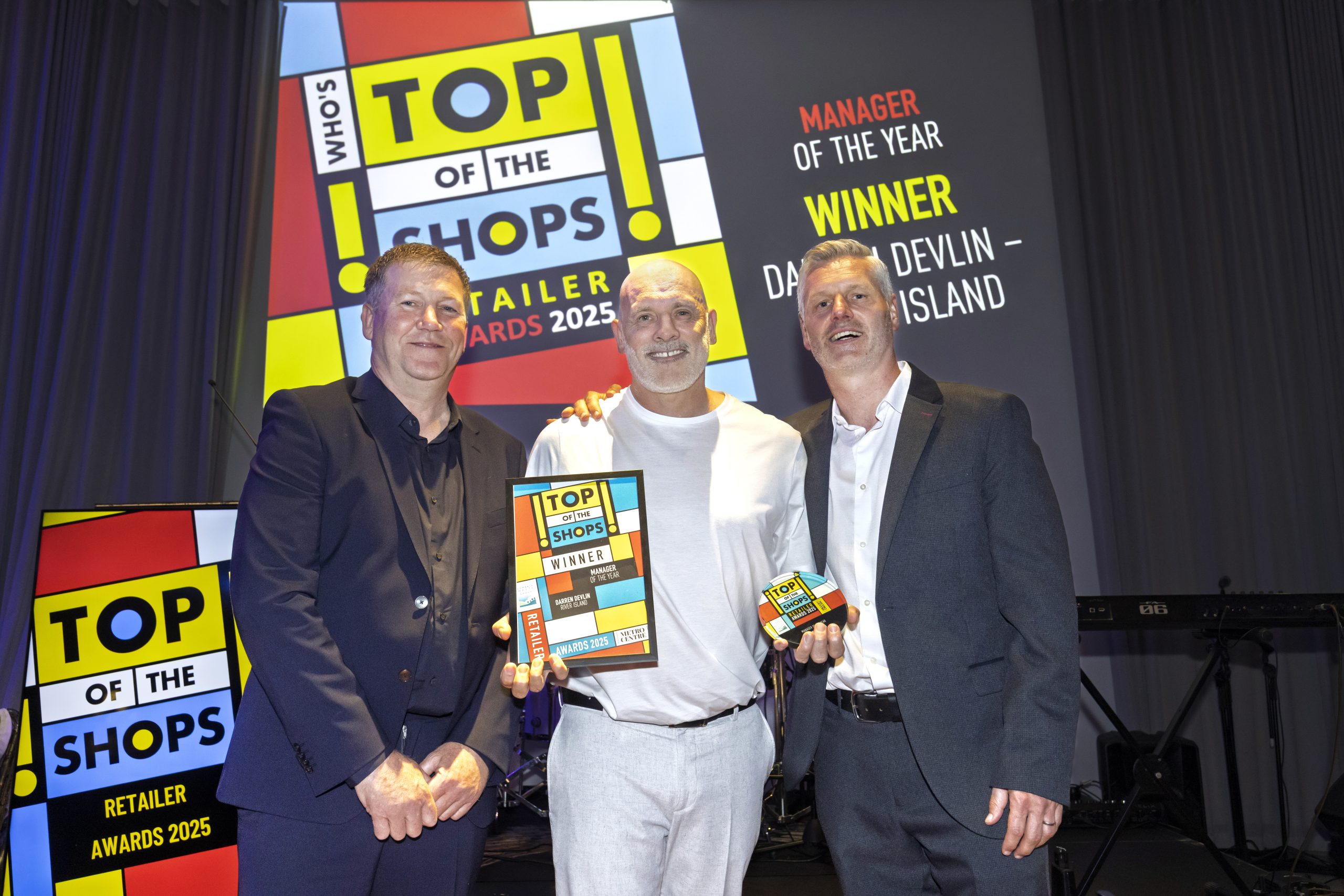 Darren being presented with Top of the Shops award