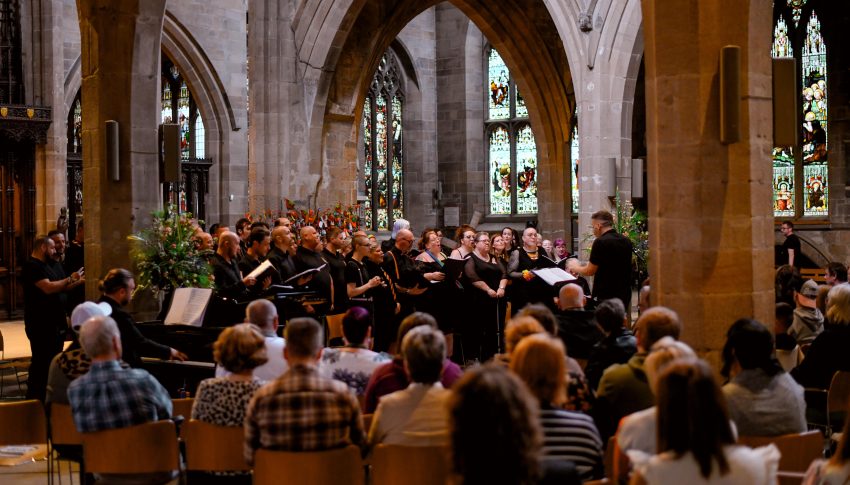 Choir singing to an audience in a cathedral