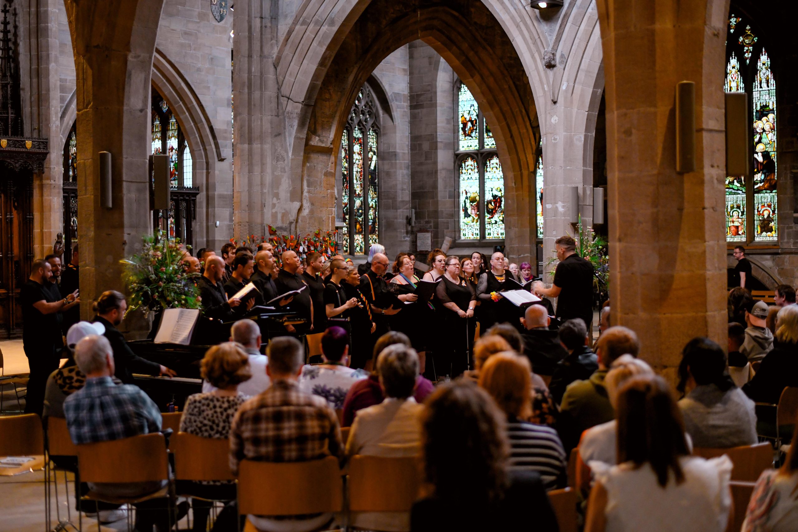 Choir singing to an audience in a cathedral