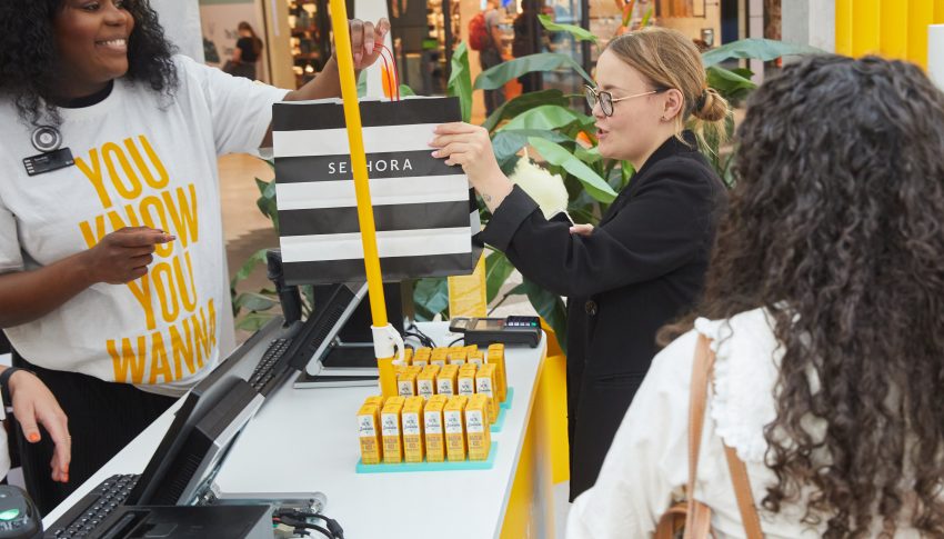 People interacting with the Sol de Janiero pop-up