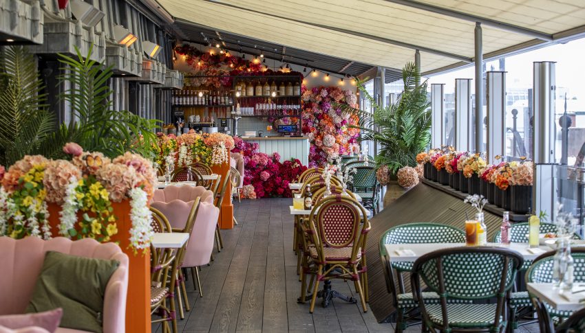 Rooftop restaurant at Fenwick decorated with colourful flowers and foliage