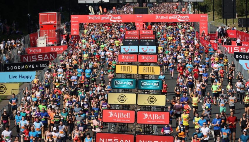 Starting line at the Great North Run with thousands of runners on the street.