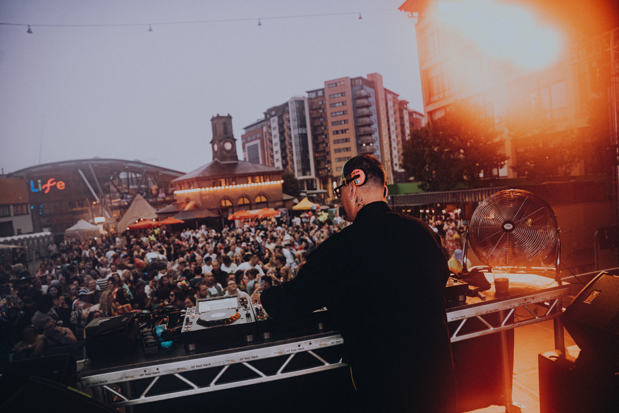 Stage view of Gok Wan djing in Newcastle with audience dancing in the background
