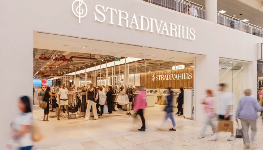 Stradivarius store front in Metrocentre with people walking through the front door.