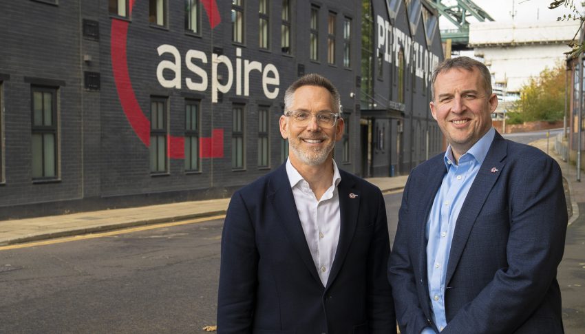 Tom Howard and Chris Fraser stood outside Aspire's offices on Gateshead Quayside.