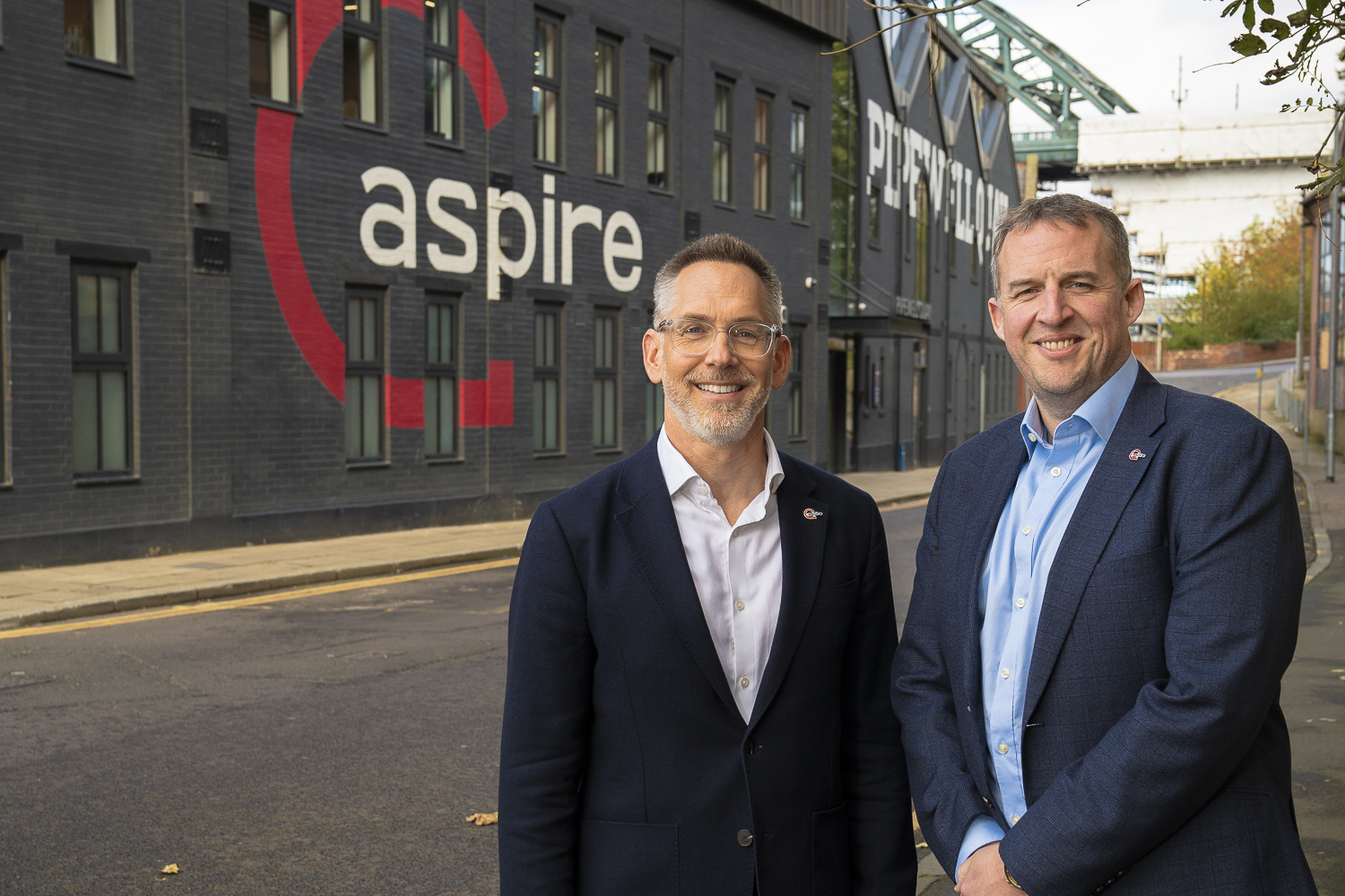 Tom Howard and Chris Fraser stood outside Aspire's offices on Gateshead Quayside.
