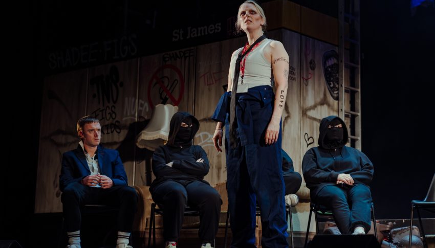 Actors performing on stage.