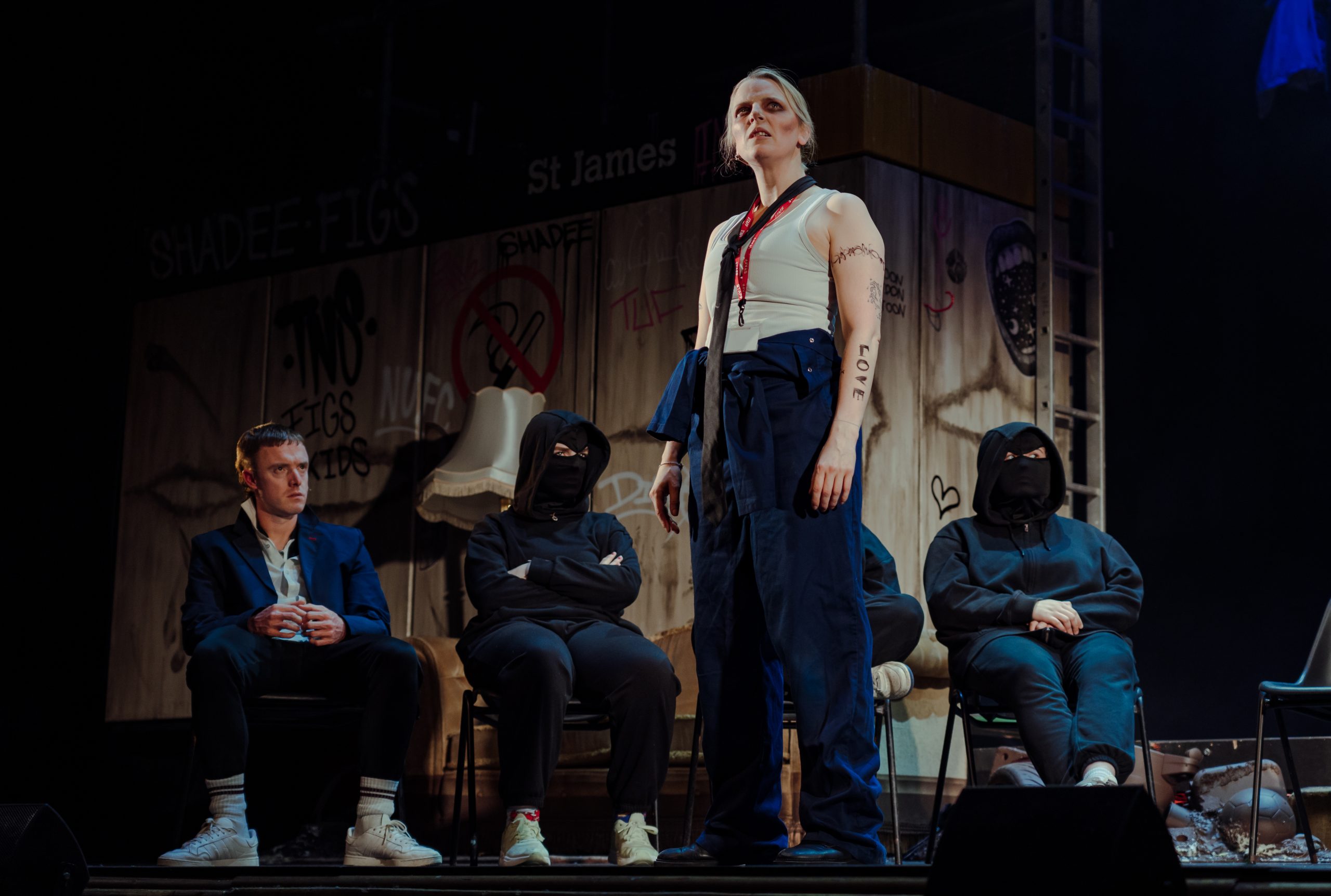 Actors performing on stage.