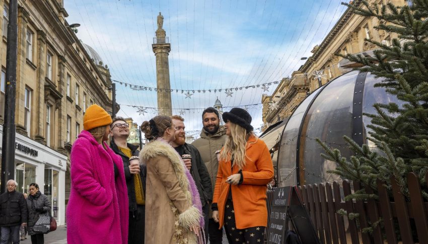A mixed group of friends walking near Newcastle Christmas market