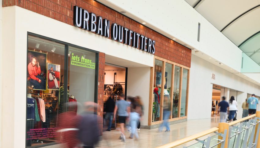 Urban Outfitters shop front in Metrocentre with lots of people walking past and into the store.