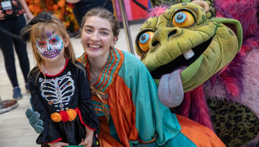 Child and adult dressed in Halloween character costumes