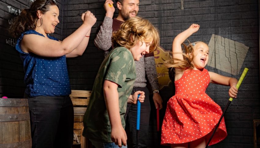Group of four children and adults dancing