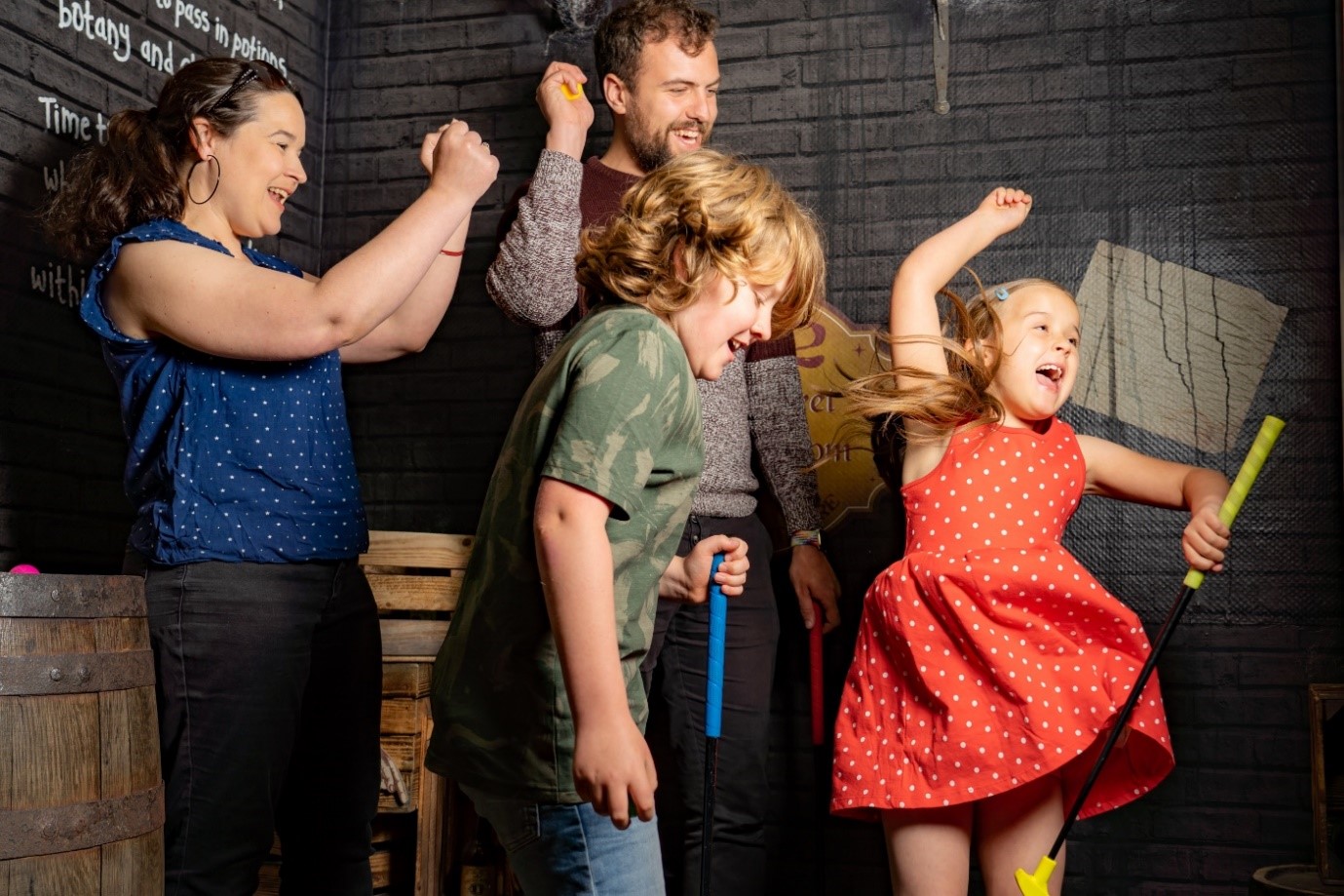 Group of four children and adults dancing