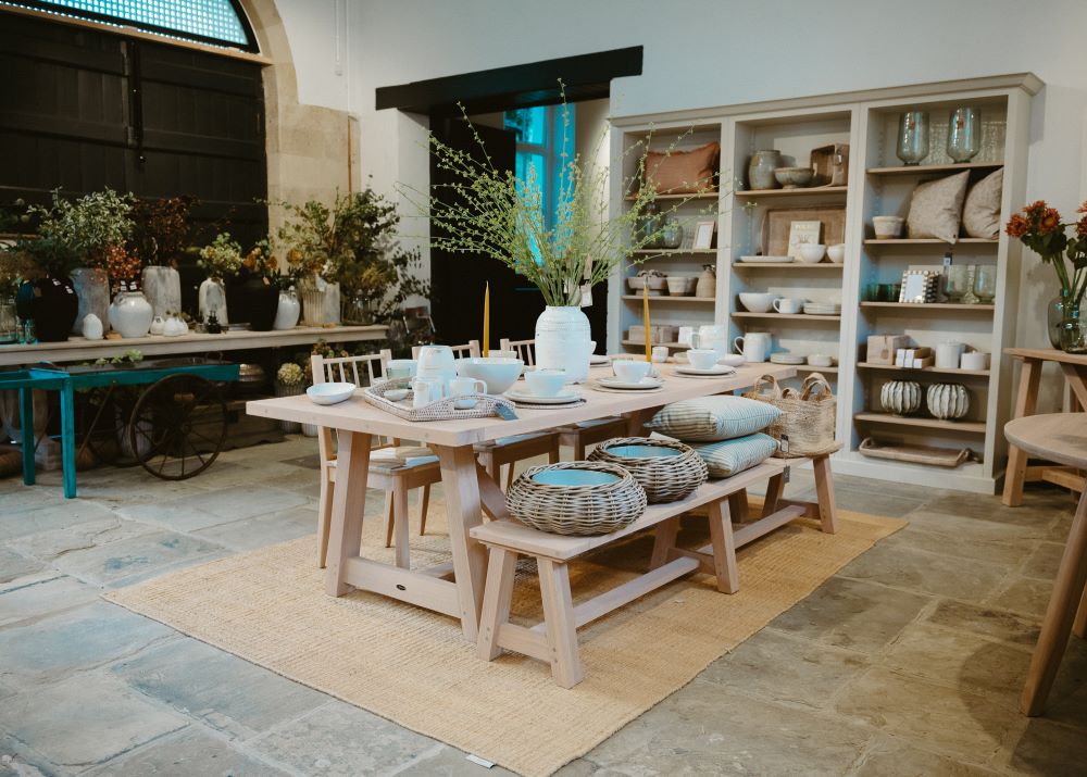 Display set for homeware in a rustic looking room.