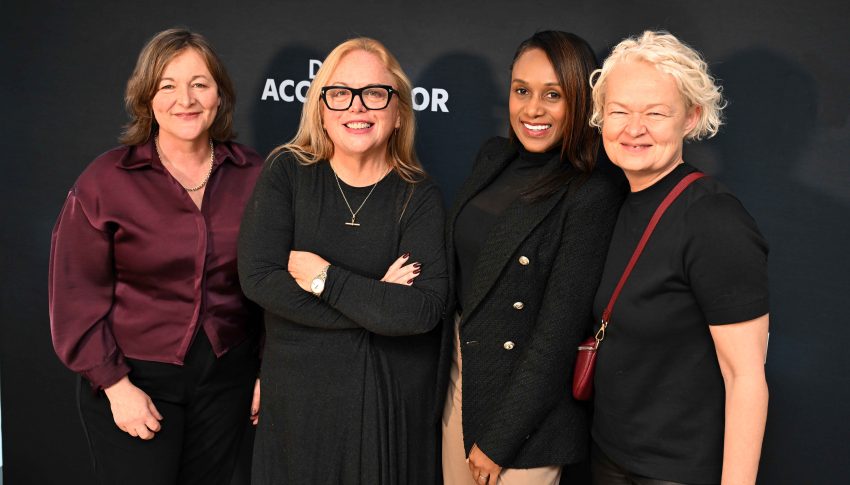 Lisa, Alison, Athena and Fiona smiling to camera as a group