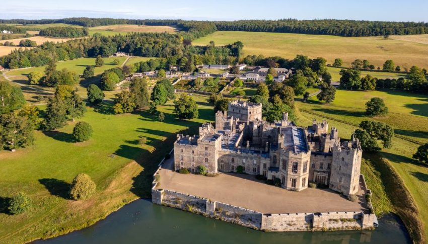 Aerial view of Raby Castle and the surrounding fields and trees.