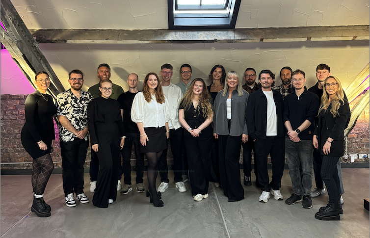 Cargo team posing in the office together.