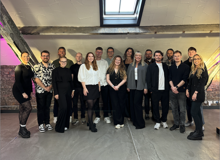 Cargo team posing in the office together.