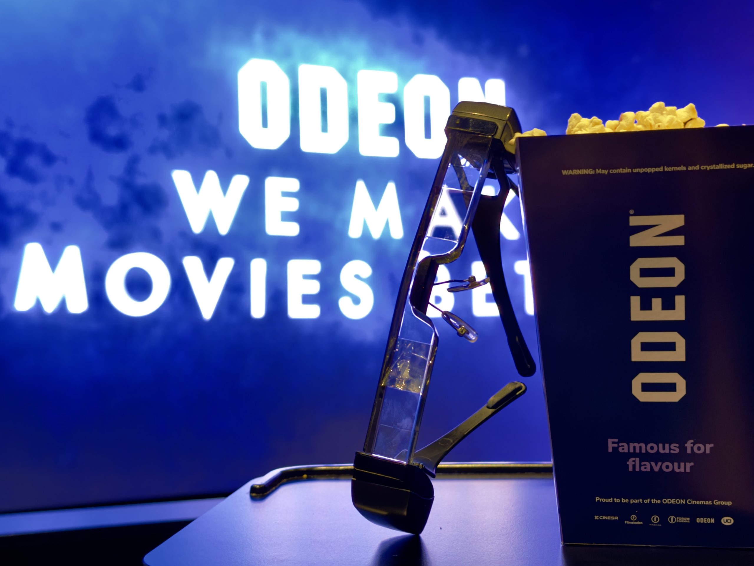 Odeon popcorn on a table together with the new glasses.