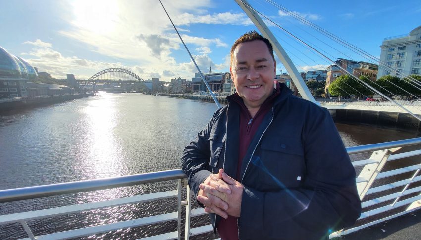 Neven Maguire on the Millennium Bridge in the sunlight.