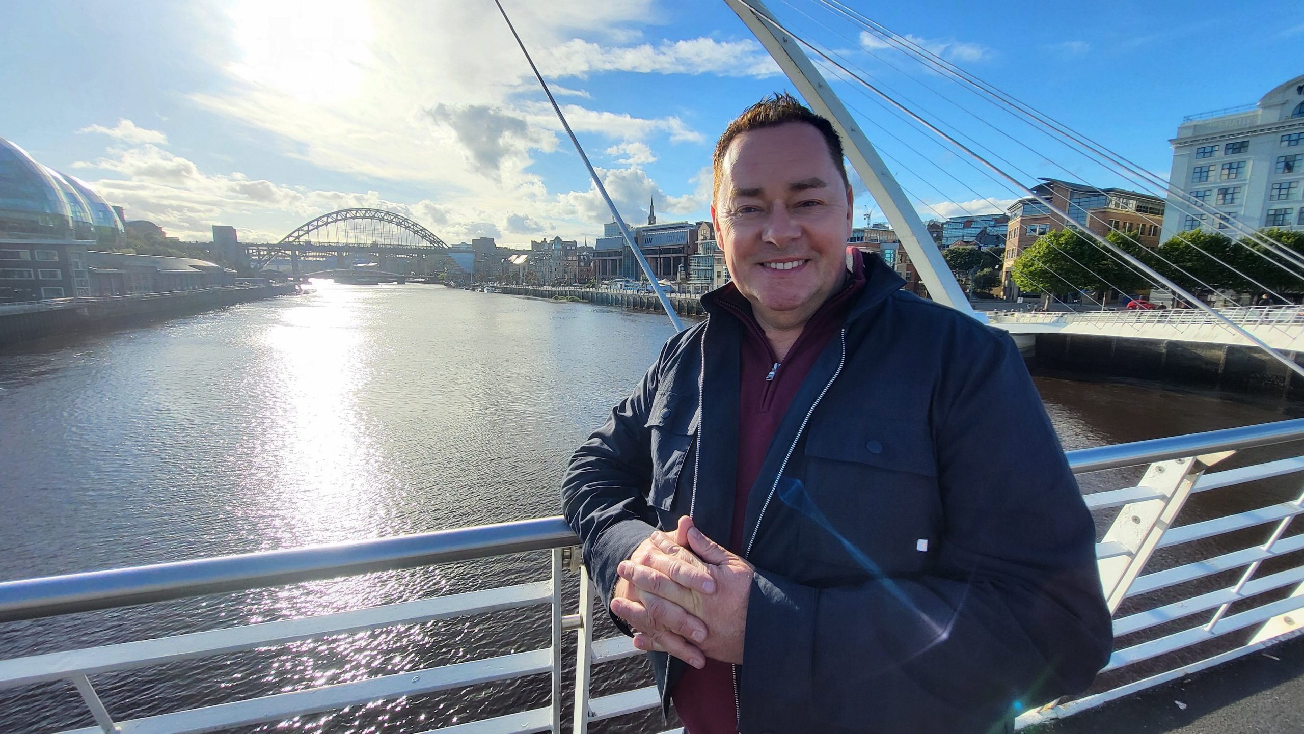 Neven Maguire on the Millennium Bridge in the sunlight.
