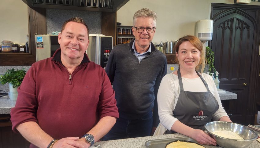 Neven in a red shirt with Emma in a white top and Andy in a grey top.