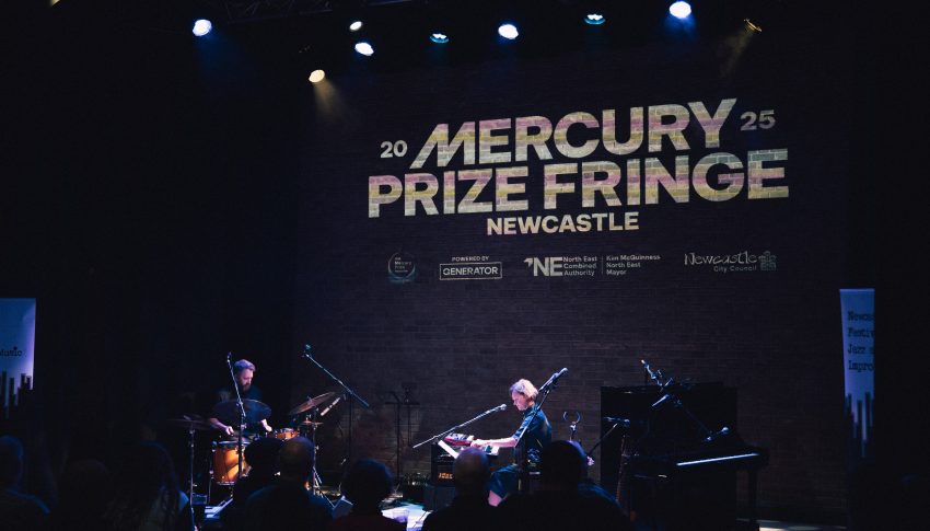 A Mercury Fringe concert in a black room.
