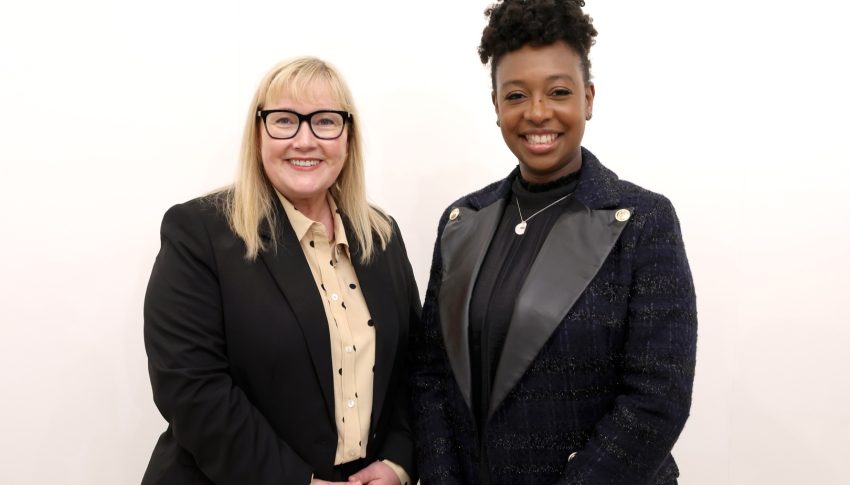 Karen and Yolanda in black suits.