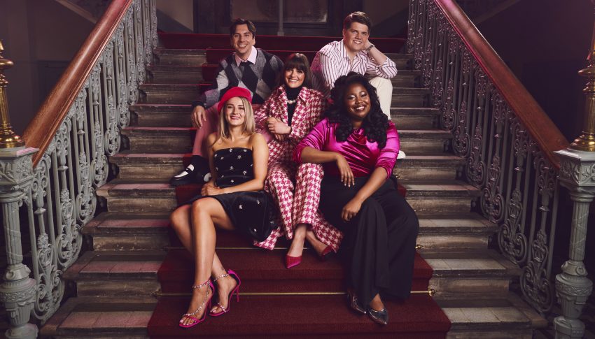 The cast of Legally Blonde musical sitting on a red staircase.