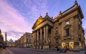 Theatre Royal under a purple sunset.